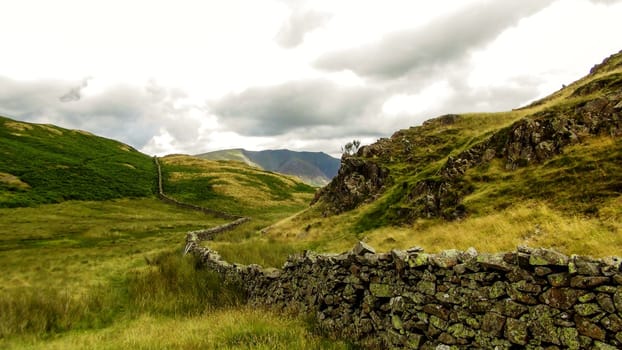 Old stone wall cutting through the hills