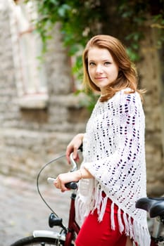 Woman in red hold tightly after bicycle wheel