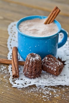 Hot chocolate in vintage cup with small chocolate cake
