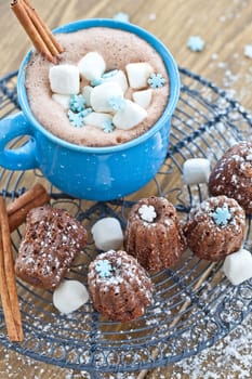 Small chocolate cake and hot chocolate with marshmallows