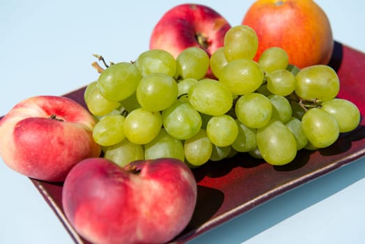 Grapes and peaches in a bowl
