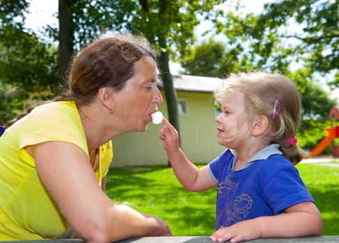 girl is playing with mothers bubblegum