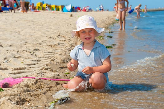 girl is playing on beach