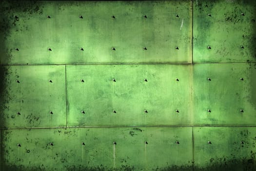 Aged copper background with screws