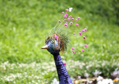 Sculpture of birds in flowers