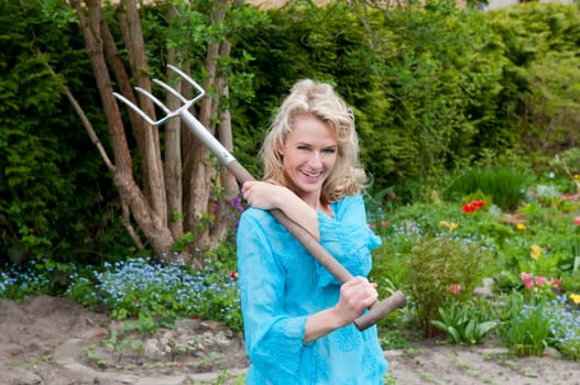 laughing woman with pitchfork