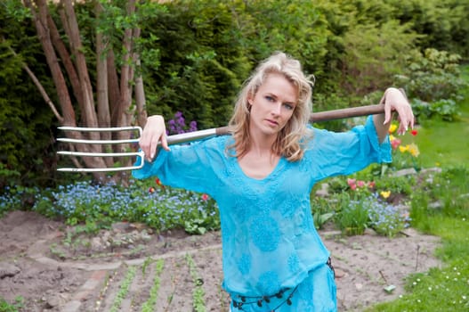 elegant blonde with pitchfork