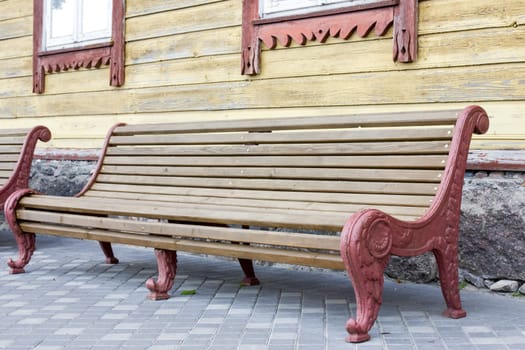 Vintage wooden bench in a yard of old house