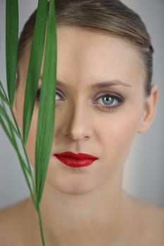 Portrait of woman with foliage