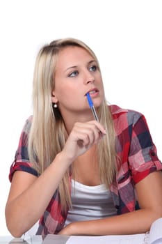 Student with a pen in her mouth