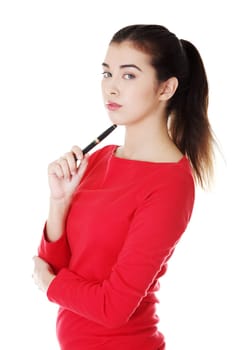 Thoughtful student girl with pen, isolated on white