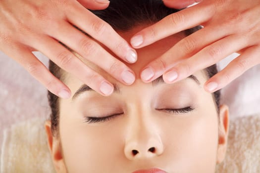 Beautiful young relaxed woman enjoy receiving massage at spa saloon