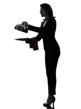one caucasian woman waiter butler opening catering dome in silhouette  on white background