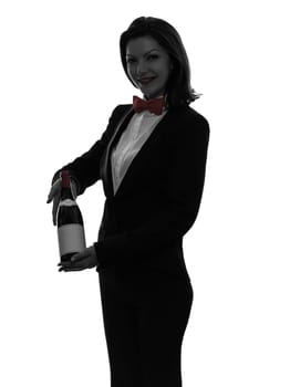 one caucasian woman waiter butler serving red wine in silhouette  on white background