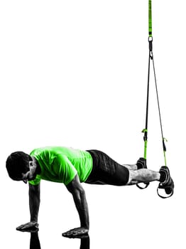 one caucasian man exercising   suspension training  trx   on white background