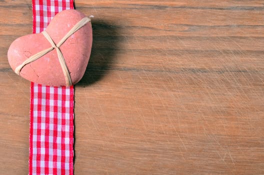old wood background with red ribbon