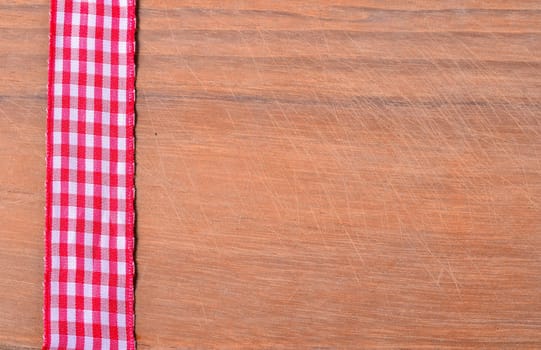 old wood background with red ribbon