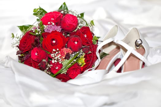 Wedding shoes and bridal bouquet