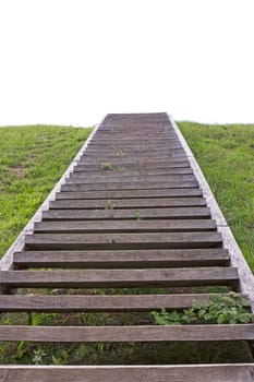 Wooden stairs climbing to the summit of the hill