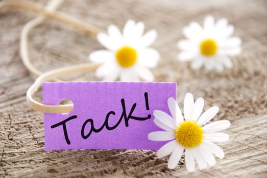 a purple label with white blossoms, copy space and background