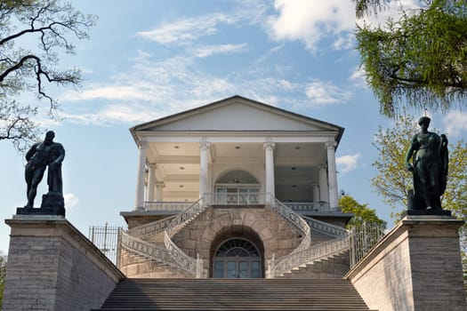 entrance to the old building, with a grand staircase sculpture