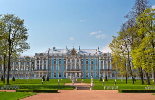 Main facade of the historic palace, Baroque style. Blue, white and gold gamma. Summer sunny day