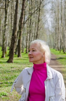 Portrait of a middle-aged woman in a spring Park