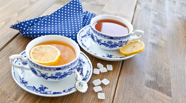 Various teas with fresh lemon and candy sugar