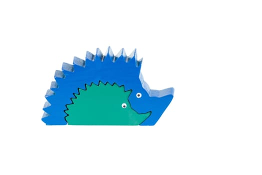 Hedgehog animal wooden puzzle over white background