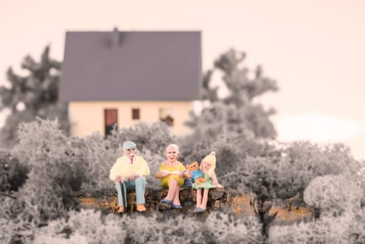 Grandparents with their grandchild in the garden
