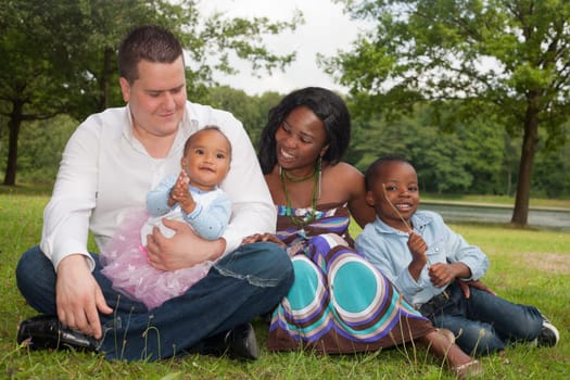 Happy mixed family is having a nice day in the park