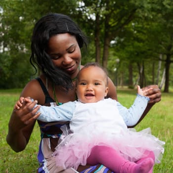 Happy mixed family is having a nice day in the park