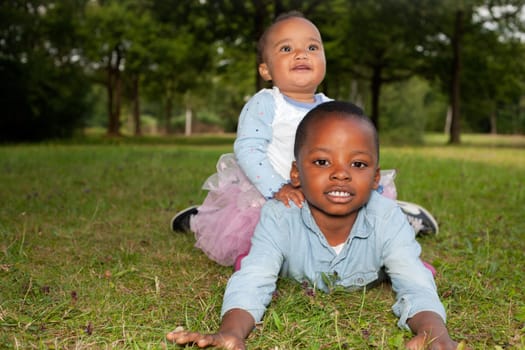 Happy little children are having a nice day in the park