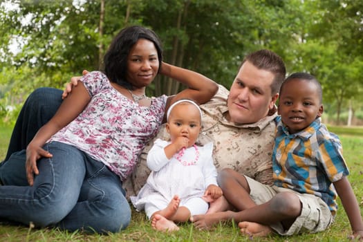 Happy mixed family is having a nice day in the park