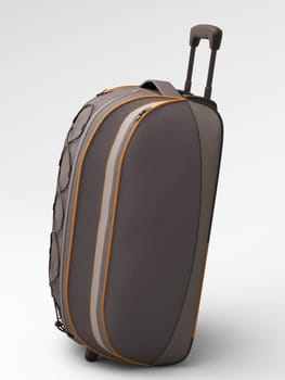 Grey travel bag close up  on light background