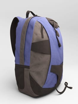 Blue travel backpack close up on a light background