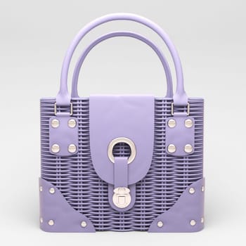 Women's lilac wicker handbag closeup on light background