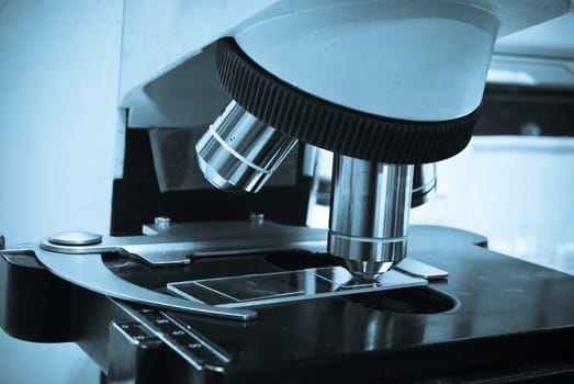 Serious clinician studying chemical element in laboratory