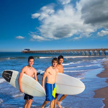 Boys surfers group coming out from Newport beach California
