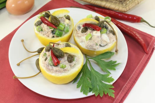 lemons stuffed with tuna cream and capers