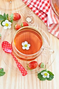 Breakfast tea with fresh strawberries in glass cups