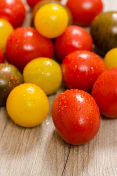 Close-up of different tomatoes in red,yellow and green in portrait format