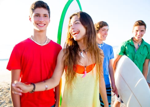 Teenager surfers boys and girls group happy in beach shore high key