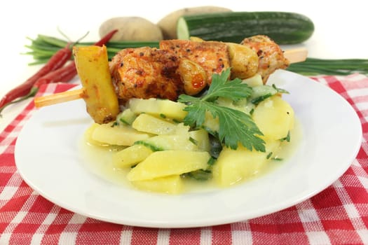 Potato-cucumber salad with a fiery skewer