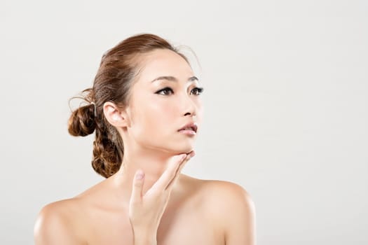 Asian beauty face closeup portrait with clean and fresh elegant lady. Studio shot.