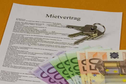 Rental agreement with house keys and banknotes