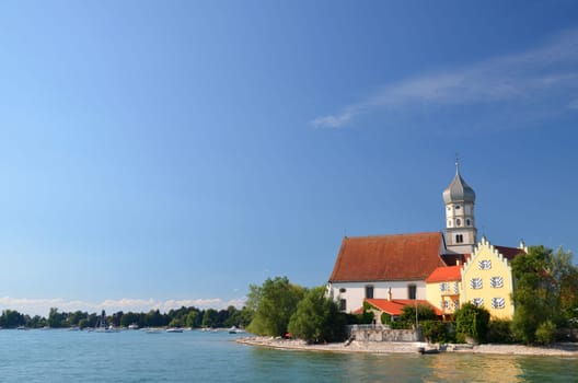 Picturesque view on church in Wasserburg on Lake Bodensee, Germany