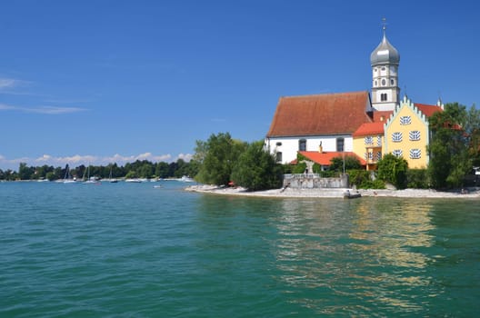 Picturesque view on church in Wasserburg on Lake Bodensee, Germany