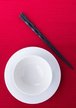 Empty bowl isolated on red background