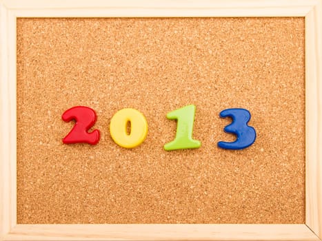 2013, written on a cork board.
